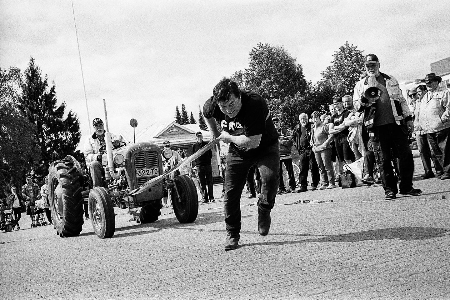 Black and white anlaog photograph of a woman eating a chocolate bar