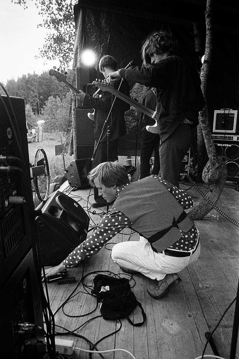 Black and white anlaog photograph of a woman eating a chocolate bar