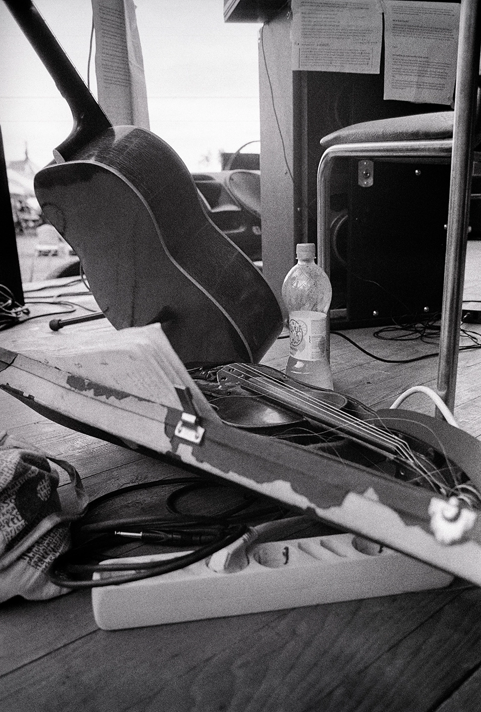 Black and white anlaog photograph of musical instruments on a performance stage